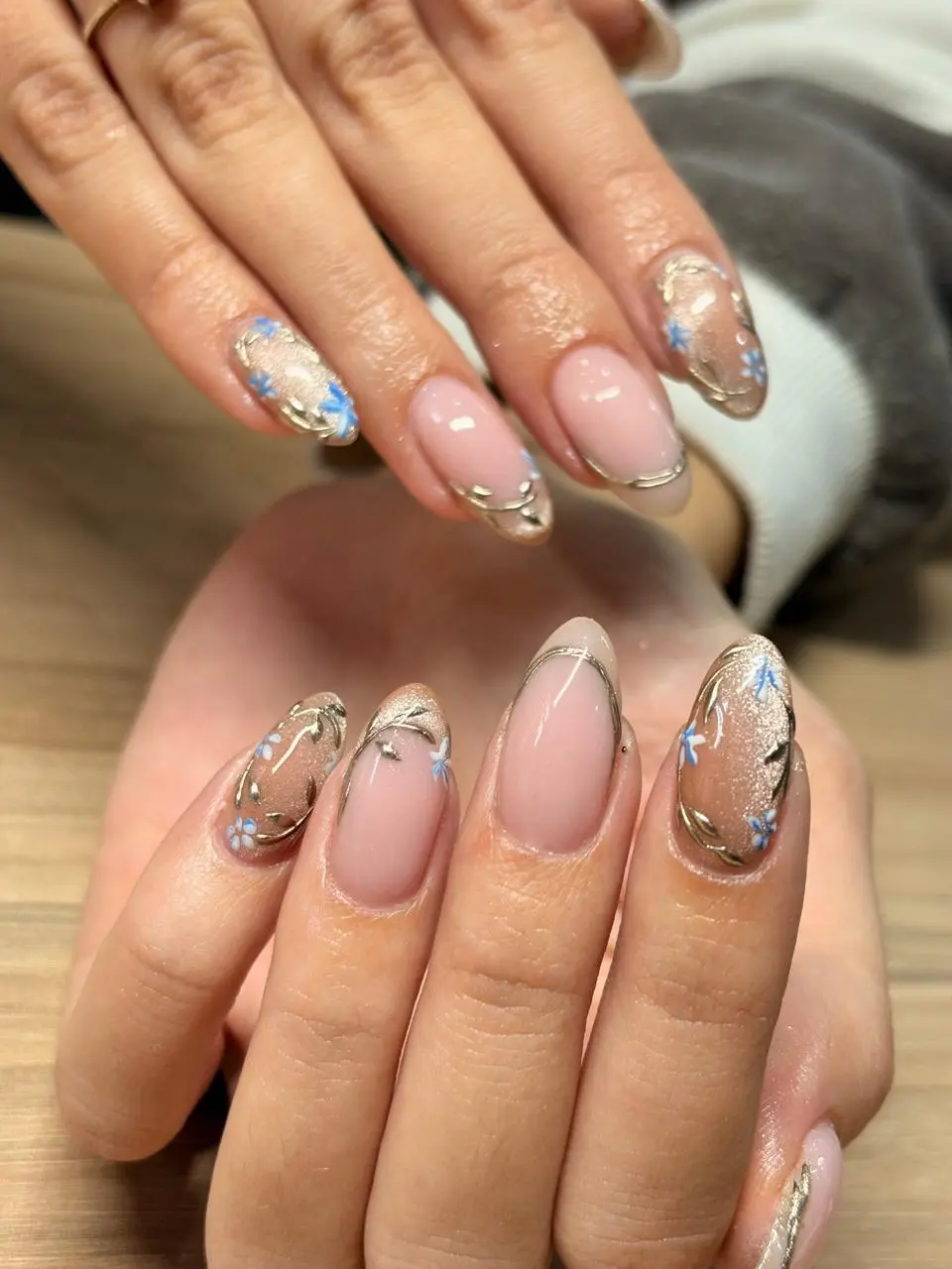 Gold and blue botanical nail art