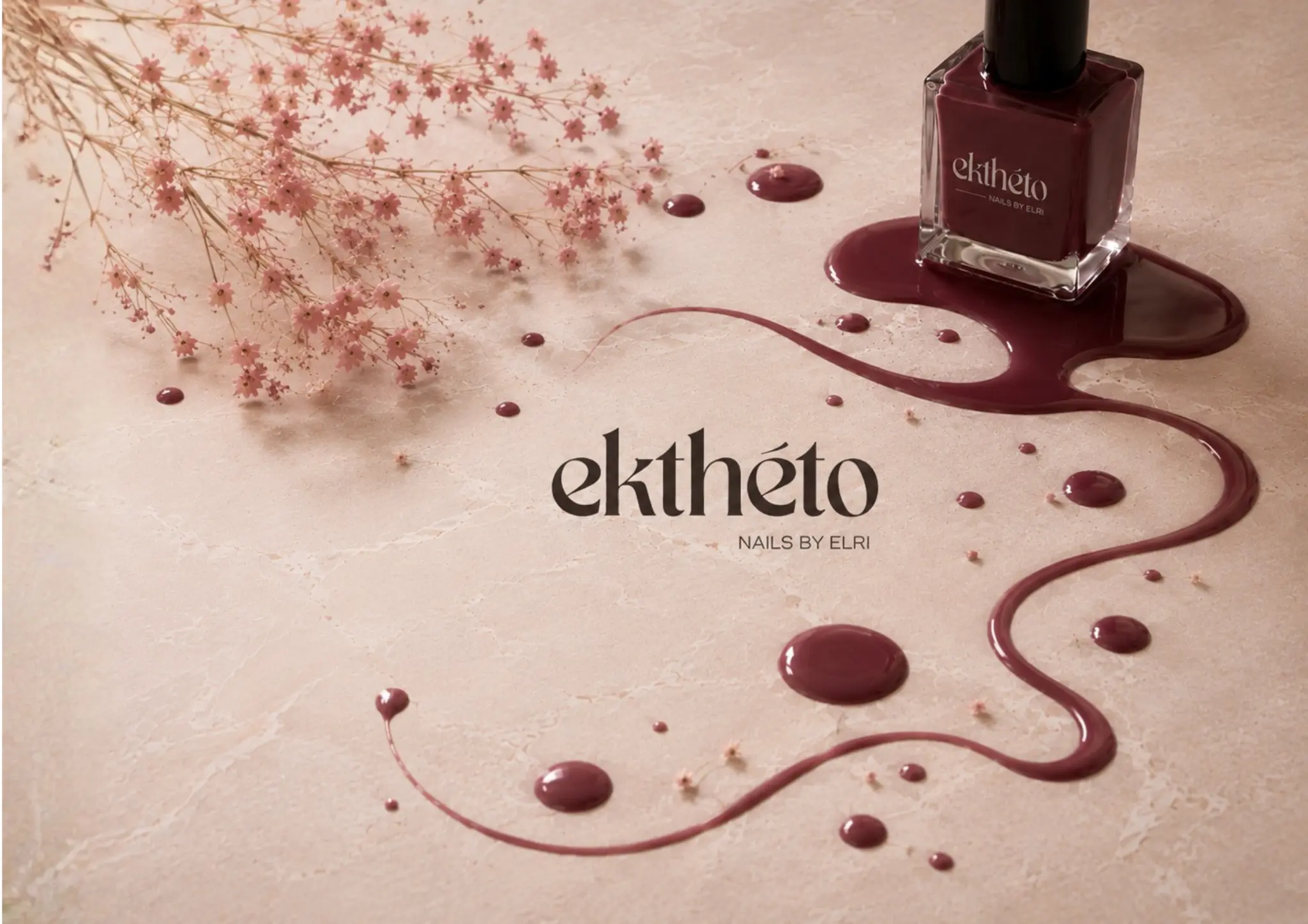 Ekthéto burgundy nail polish with delicate wildflowers