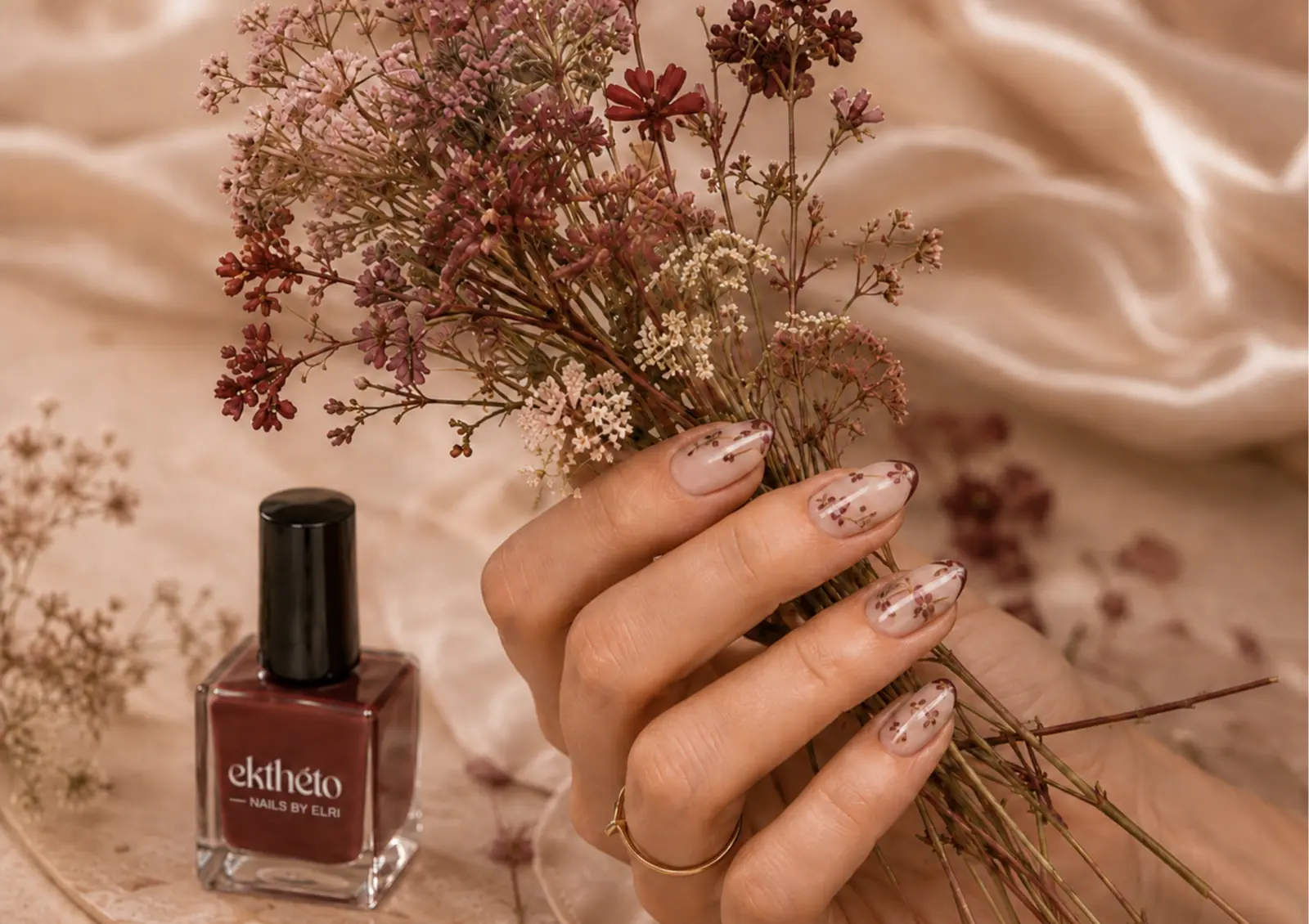 Wildflower manicure holding a bouquet